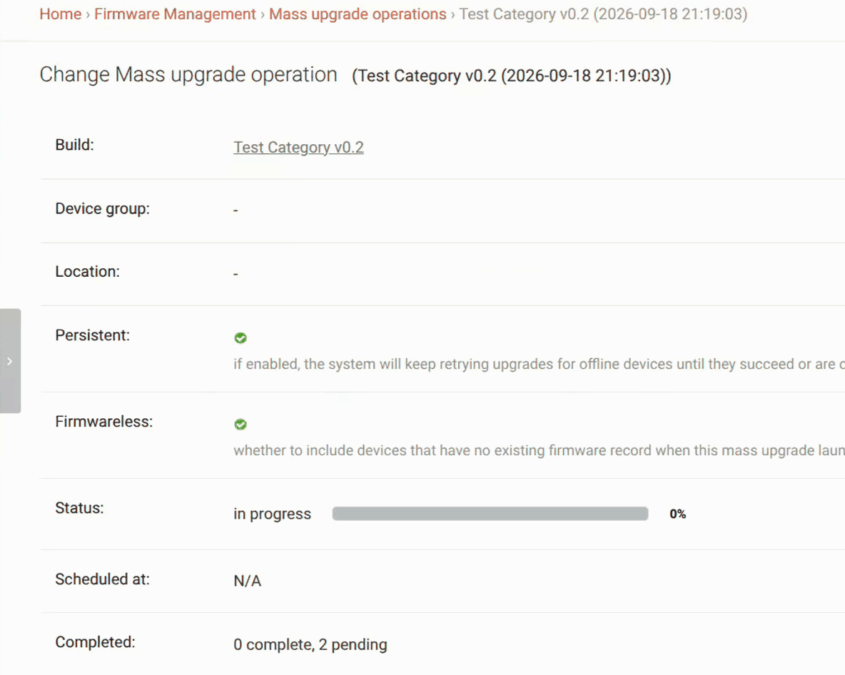 A persistent mass upgrade completing: the batch goes from 0 of 2 done to 1 of 2 as a recovered device finishes